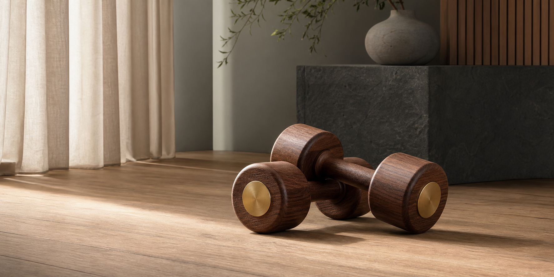 Premium walnut wooden dumbbells in a calm home wellness space
