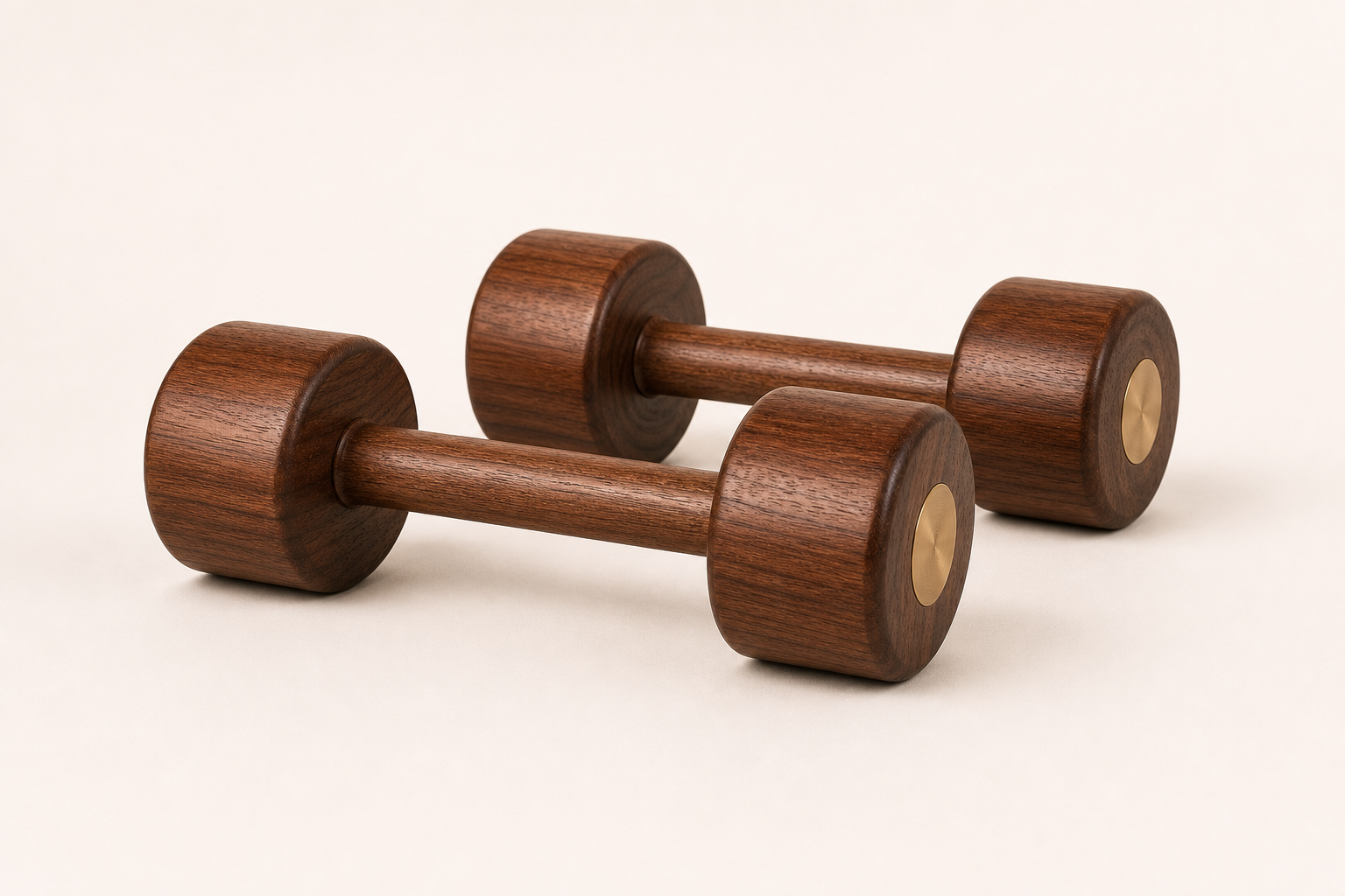 Lifeventra solid walnut wooden dumbbell pair on a warm studio background